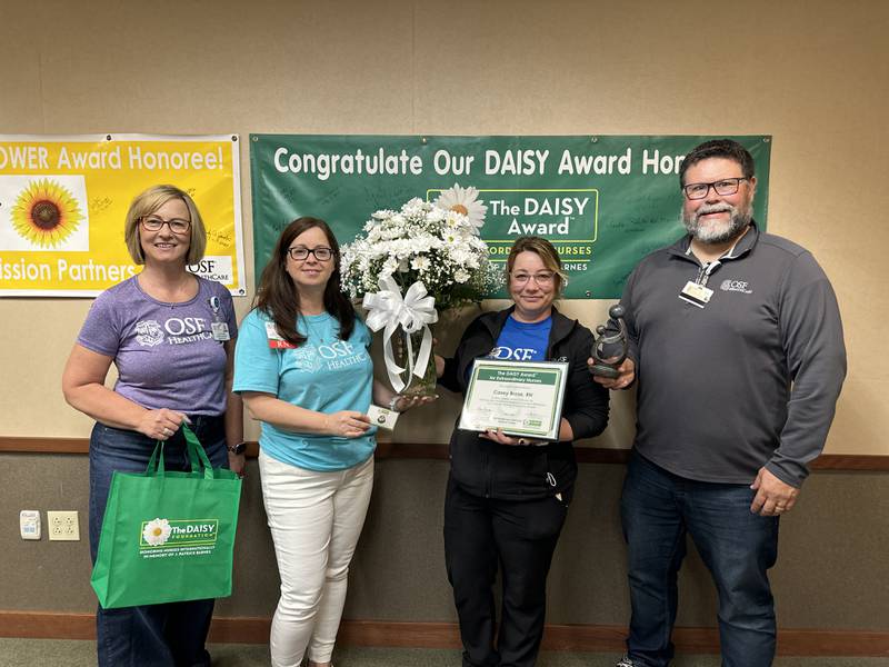 Jackie Kernan, president; Lisa Garcia, chief nursing officer; Casey Brose, BSN, RN, DAISY Awards Winner; and Jason Bitner, Emergency Department manager pose for a photograph after Brose was named the 2024 DAISY Award winner at OSF Saint Luke in Kewanee.