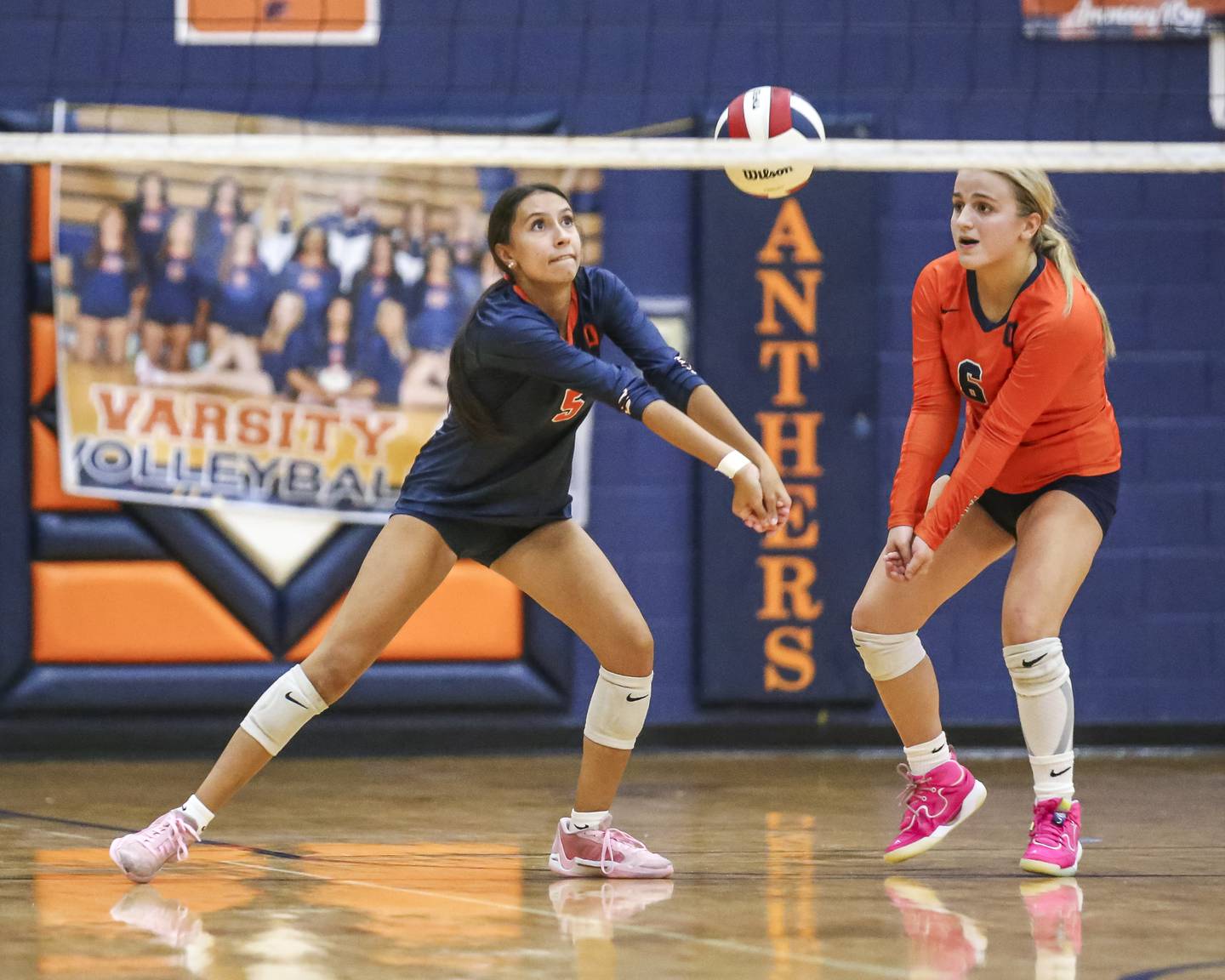 Oswego's Kimmy Jasinski (5) digs the ball during volleyball match between Yorkville at Oswego. Sept 23, 2025.