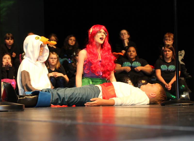 Scuttle (Jaxton Anderson) and Ariel (Piper Brandenburg) rescue Prince Eric (Mason Moore) during the Streator Elementary Schools production of "The Little Mermaid Jr." Friday, May 5, 2023, at the Streator High School Auditorium.