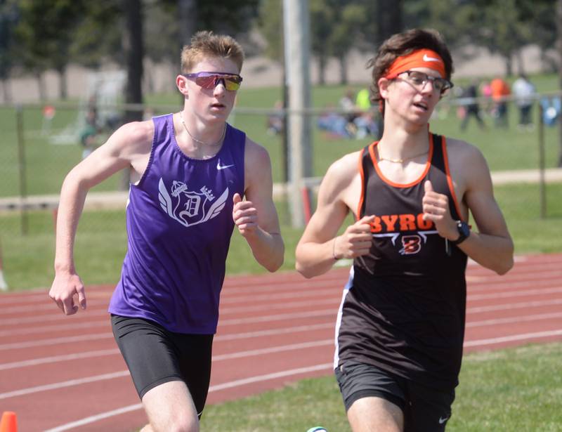 Dixon's Averik Wiseman chases Byron's Tim Starwalt as they round the final curve in the 3200 meters at the Gebhardt-Worley Invitational at Oregon High School on Saturday, April 12, 2025. Whiteman won the event in 10:00.32 edging Starwalt who finished second in 10:00 97.