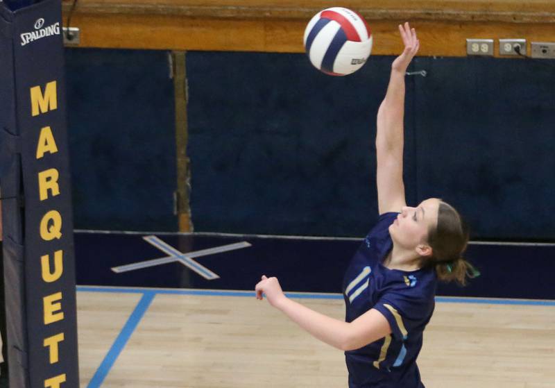 Marquette's Ava Offermann spikes the ball to St. Bede on Thursday, Sept. 4, 2025 at Bader Gym.