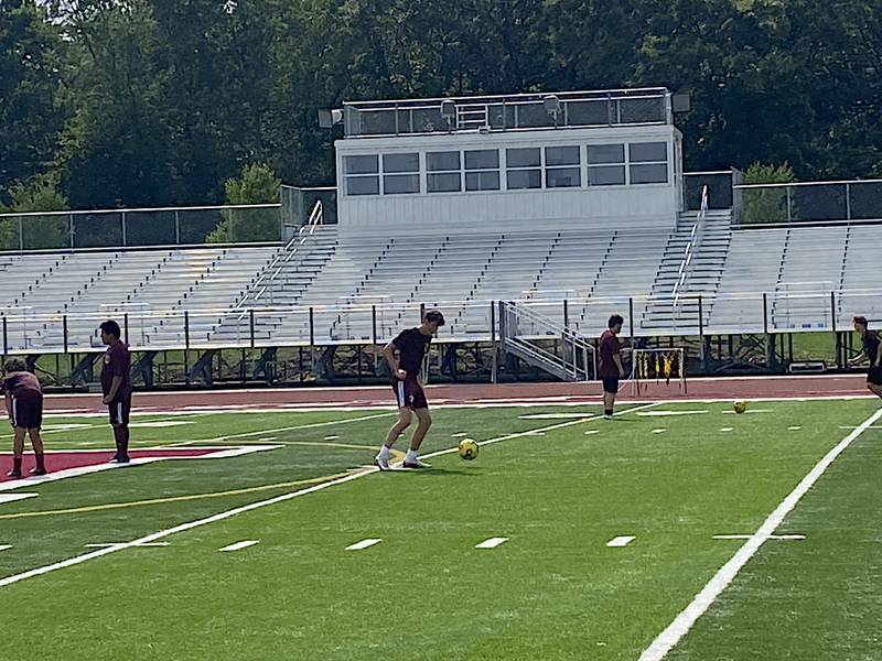 The Morris boys soccer team runs through drills during a recent practice.