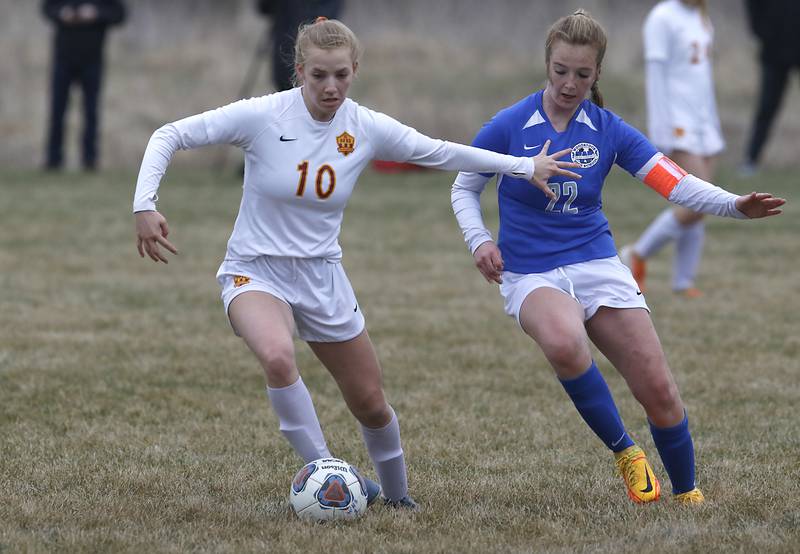Richmond-Burton's Margaret Slove controls the ball in front of Woodstock's Reese Freund during a Kishwaukee River Conference soccer match Wednesday, April 30, 2022, between Richmond-Burton and Woodstock at Creekside Middle School.