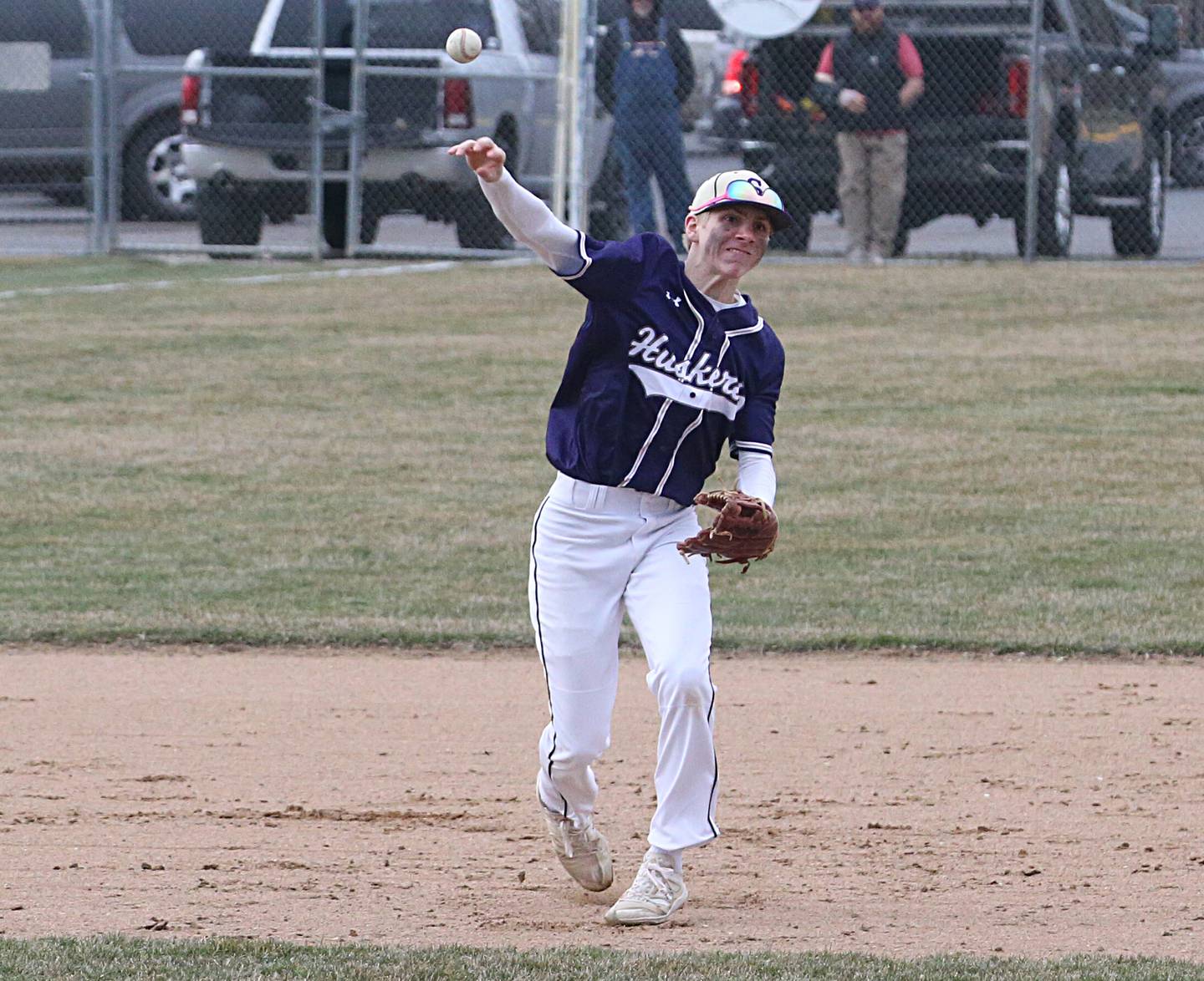Serena shortstop Tanner Faivre throws to first base to force out an Ottawa runner during a game last season at Ottawa High School.