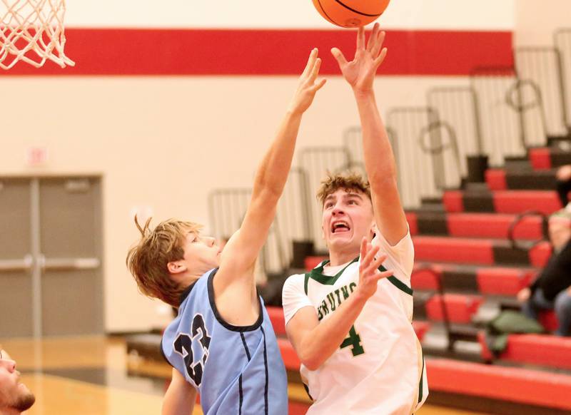 St. Bede's Gino Ferrari shoots a jump shot over Bureau Valley's Brandon Carrington during the 50th annual Colmone Classic on Thursday, Dec. 12, 2024 at Hall High School.