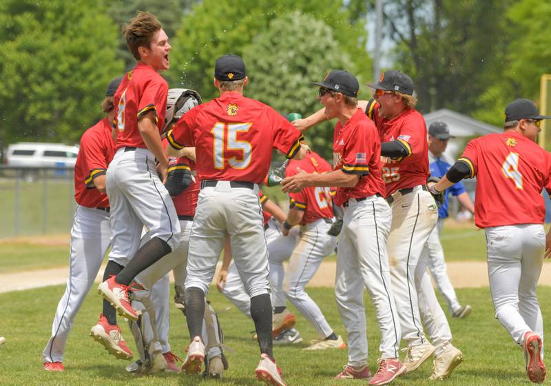 Batavia celebrates their 4-3 win over St. Charles North to capture the Geneva Regional Championship on Saturday, May 27, 2023.