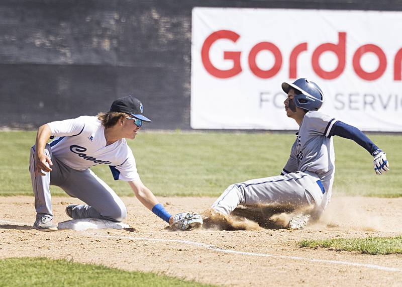Newman’s Garet Wolfe puts down the tag but Chicago Hope’s Camron Centeno is called safe in a supersectional baseball game Monday, May 29, 2023.