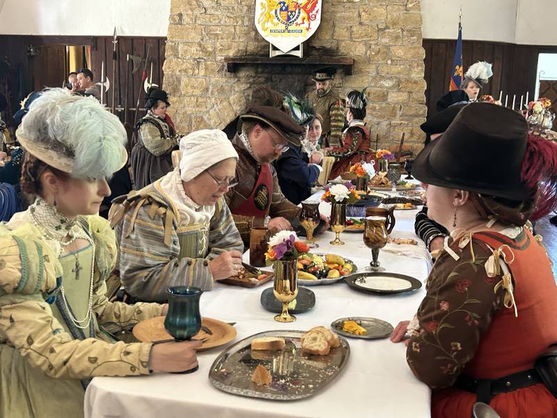 The queen and her court enjoy a meal in the Great Hall at Stronghold Castle during the Olde English Fair at Stronghold Camp & Retreat Center on Saturday, Oct. 5, 2024. The fair is held during the Autumn on Parade festival in Oregon.