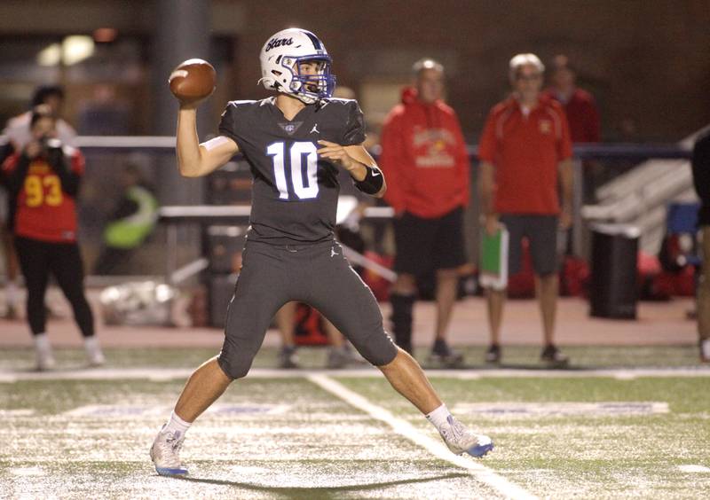 St. Charles North quarterback Ethan Plumb passes the ball during a home game against Batavia on Friday, Sept. 15, 2023.