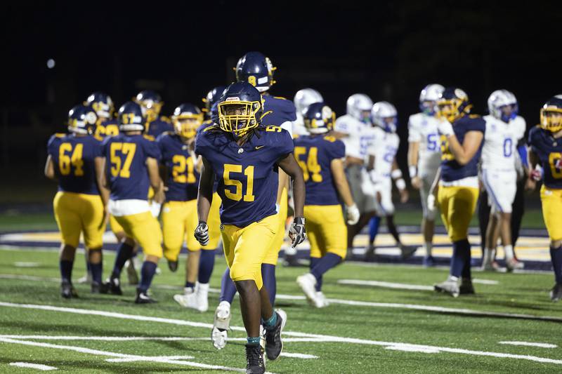 Sterling’s Jeremiah Muhammad comes off the field after the Warriors scored a TD against Quincy Friday, Oct. 17, 2025.
