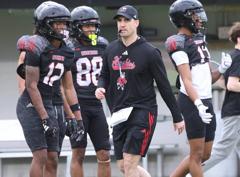 Northern Illinois University head football coach Rob Harley watches his team Tuesday, April 14, 2026, during spring practice in Huskie Stadium at NIU in DeKalb.