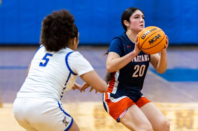 Romeoville's Julissa Olague takes a shot during a varsity girls basketball game against Joliet Central at Joliet Central on Dec. 18, 2025.