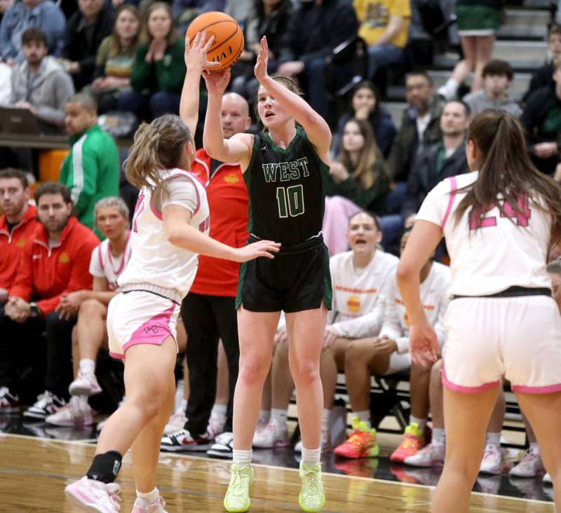 Glenbard West's Julia Benjamin shoots three points during the Class 4A St. Charles East Sectional final against Batavia on Thursday, Feb. 27, 2025 in St. Charles.
