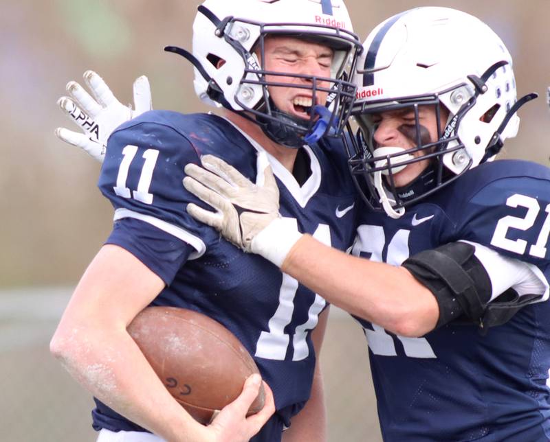 Cary-Grove’s Peyton Seaburg, left celebrates a touchdown with Ben Roseland against Belvidere North in IHSA Class 6A quarterfinal playoff football action on Saturday, Nov. 16, 2024, at Al Bohrer Field on the campus of Cary-Grove High School in Cary.