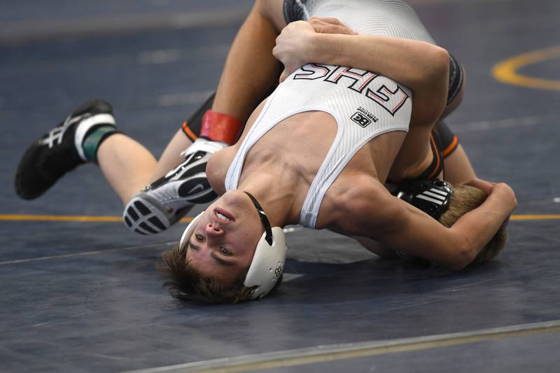 Fulton's Hudson Price flexes to try and break a hold by Freeport's Treyden Diduch in the championship match at 113 pounds at the Polo Wrestling Invitational on Saturday, Jan, 10, 2026 at Polo High School.
