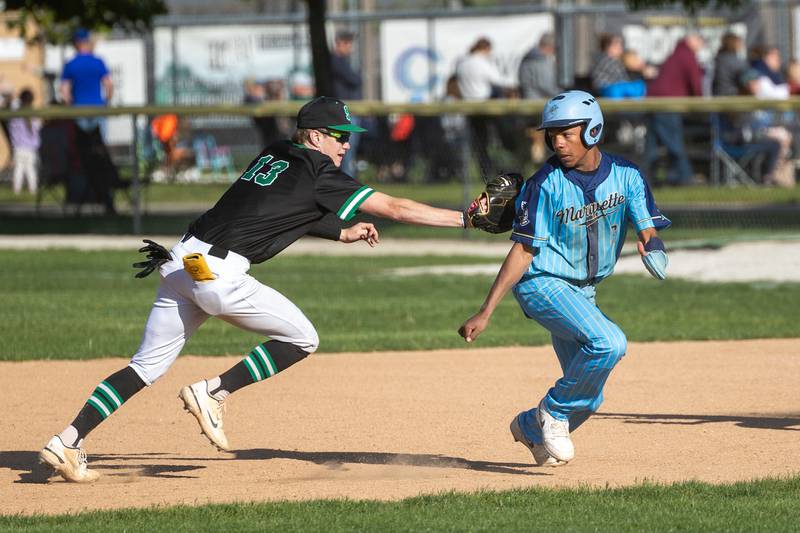 Paxton Giertz (13) of Seneca tags out Connor Baker (6) of Marquette as he attempts to reach second base on Thursday, May 8, 2025 at Masinelli Field in Ottawa.