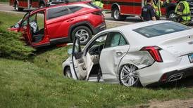2 injured in crash that landed 2 cars in a ditch in Woodstock 