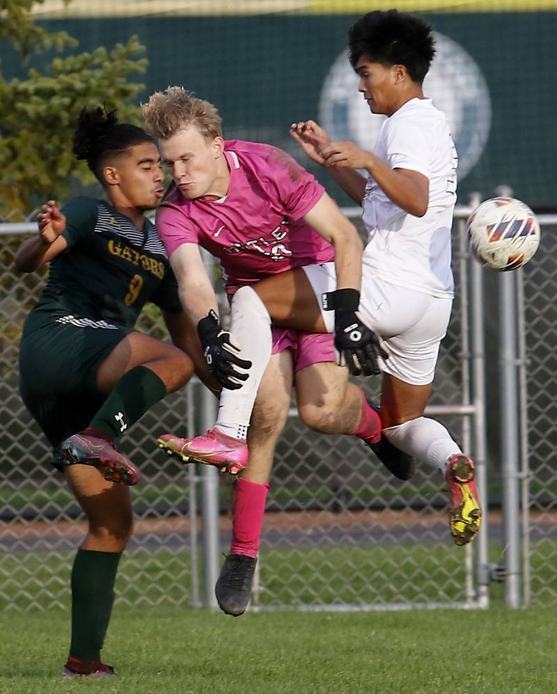 Huntley's Jack Bakey is sandwiched between his teammate, Kyle Paler, and Crystal Lake South's Ali Ahmed as Ahmed tries to score a goal during a Fox Valley Conference soccer match on Thursday, Sept. 28, 2023, at Crystal Lake South High School.