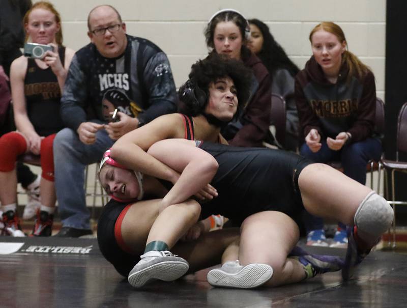 Huntley’s Nariah Adams tries to get out of the grasp of Morris’ Tessa Niekirk in the 140-pound match of a nononference wrestling meet on Wednesday, Jan. 22, 2025, at Huntley High School.