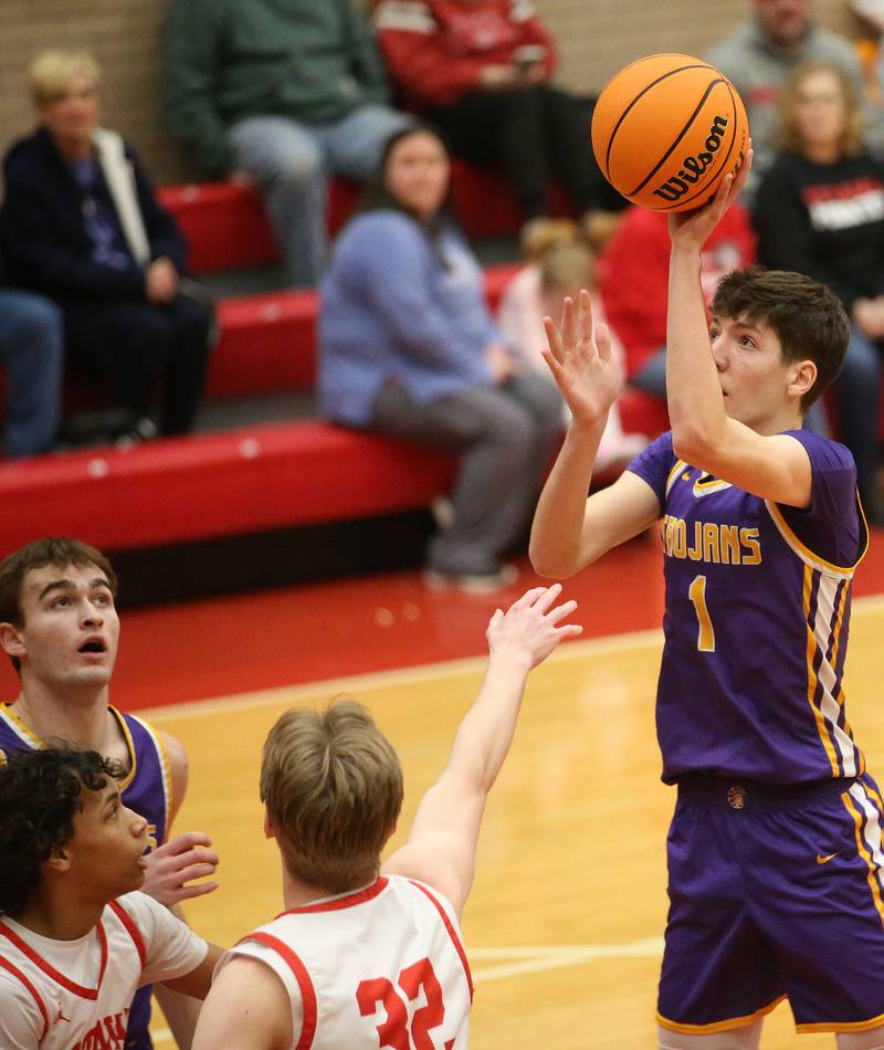 Mendota's Cole Tillman lets go of a shot over Ottawa's Hezekiah Joachim and Aric Threadgill on Tuesday, Jan. 7, 2025 in Kingman Gym at Ottawa High School.