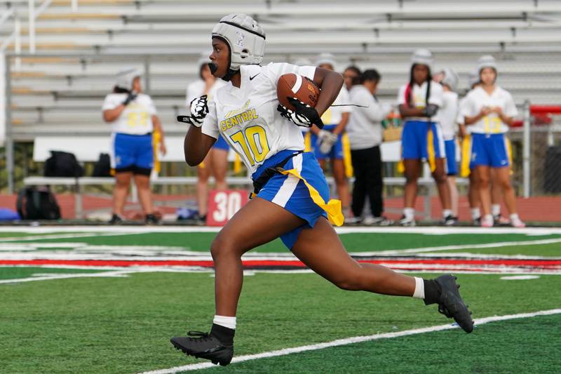 Joliet Central's Ta’tyanna Nicks (10) carries the ball against Yorkville during a flag football game at Yorkville High School on Monday, Sep 23, 2024.