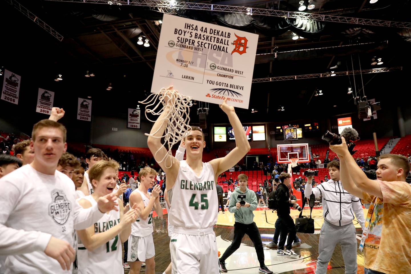 Glenbard West’s Ryan Renfro celebrates the team’s Class 4A DeKalb Supersectional game win over Larkin at the Northern Illinois University Convocation Center on Monday, March 7, 2022.