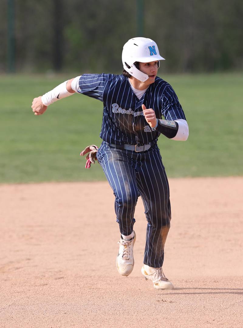 Nazareth's Jaden Fauske (21) takes off for third base during the varsity baseball game between Benet Academy and Nazareth Academy in La Grange Park on Monday, April 24, 2023.