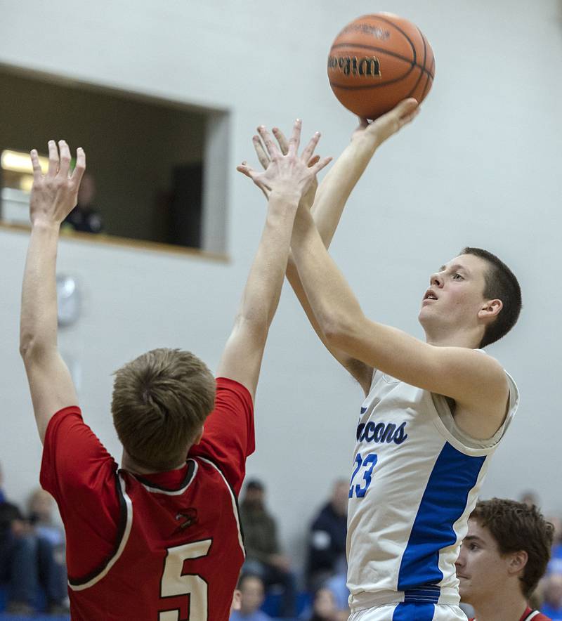 Faith Christian’s Logan Baker works on the paint against QC Christian’s Koltin Wolf Tuesday, Dec. 9, 2025.