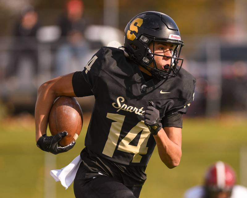Sycamore's Josiah Mitchell (14) runs the ball during the class 5A playoff game on Saturday Nov. 2, 2024, while taking on Chicago Bulls College Prep at Sycamore High School.