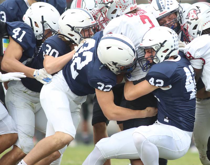 Cary-Grove’s defense brings down Antioch’s Martin Cohen in IHSA Class 6A second-round playoff football action on Saturday, Nov. 9, 2024, at Al Bohrer Field on the campus of Cary-Grove High School in Cary. From left, Nate Jonas, Landon Moore, Trae Kole and Brayden Tamason are in on the tackle.