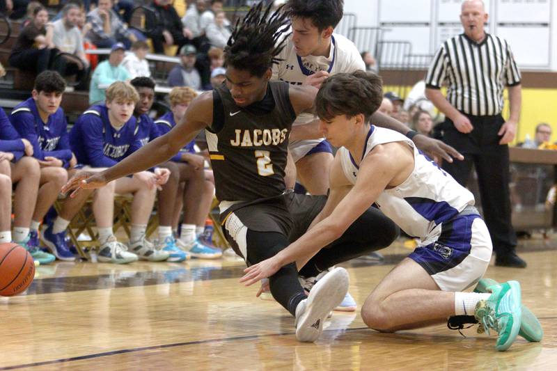 Jacobs’  Treval Howard (2) loses a handle on the ball as he tussles with Lake Zurich’s Adrian Riep in Hinkle Holiday Classic boys basketball tournament game action at Jacobs High School Tuesday.