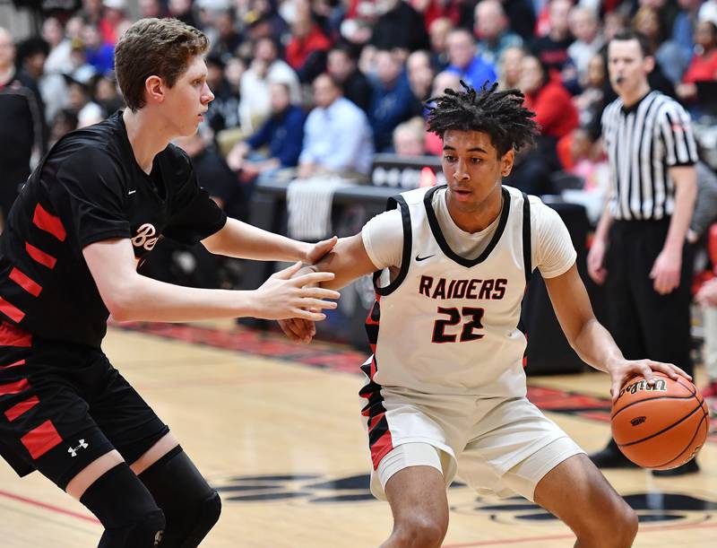 Bolingbrook's JT Pettigrew starts a move as Benet's Colin Stack defends during a Class 4A East Aurora Sectional semifinal game on Feb. 27, 2024 at East Aurora High School in Aurora.