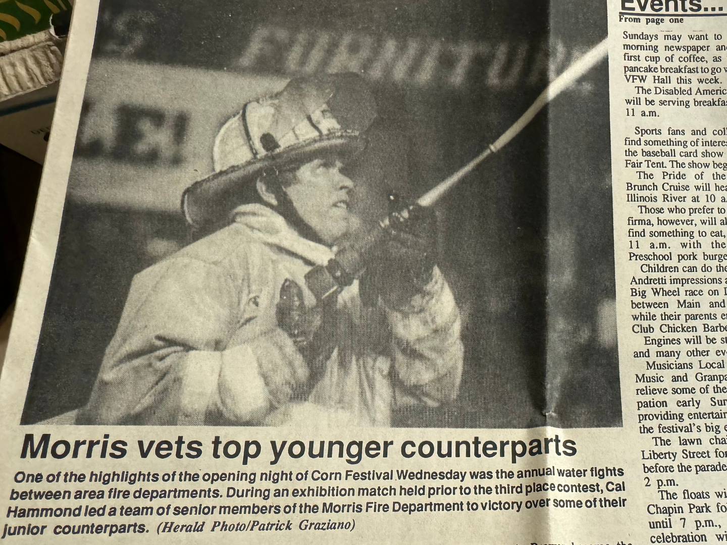 Cal Hammond participates in a water fight in an old edition of the Morris Daily Herald.