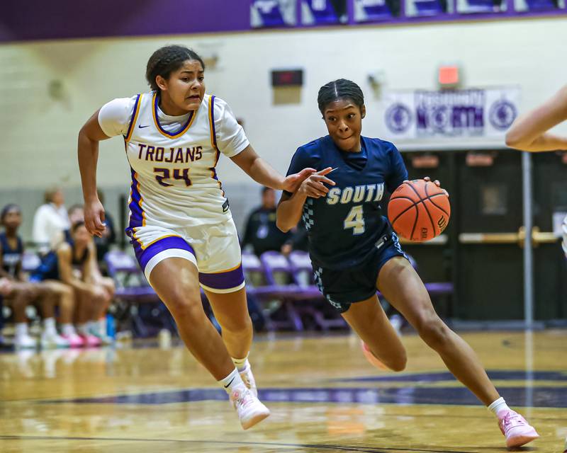 Downers Grove South's Hayven Harden (4) drives to the basket during girls basketball game between Downers Grove South at Downers Grove North. Dec 16, 2023.