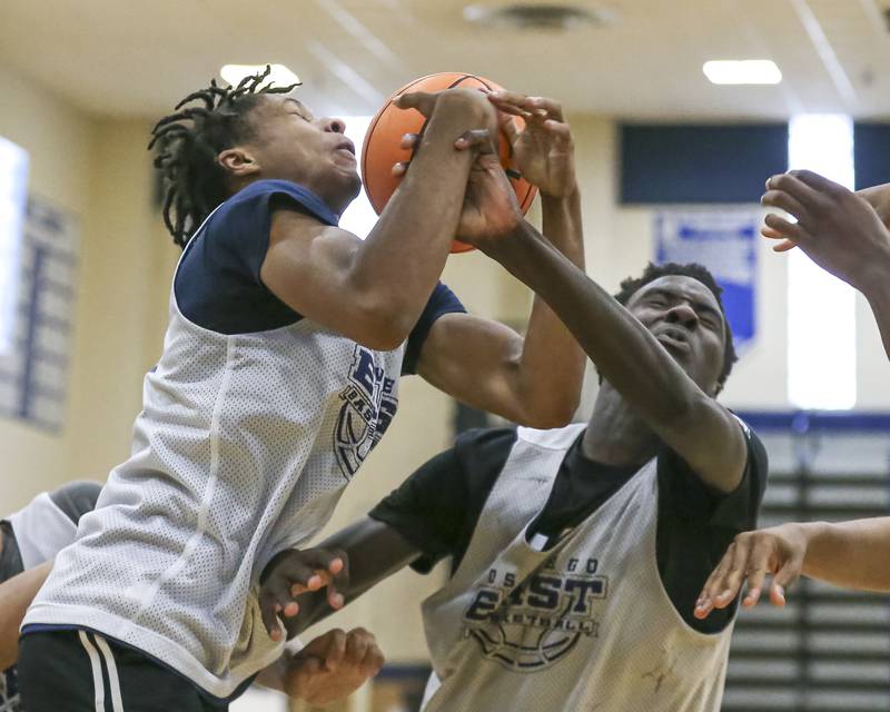 Oswego East's Dshaun Bolden (L) fights for possesion in their Riverside-Brookfield Shootout basketball game.  June 20, 2025 in Riverside.