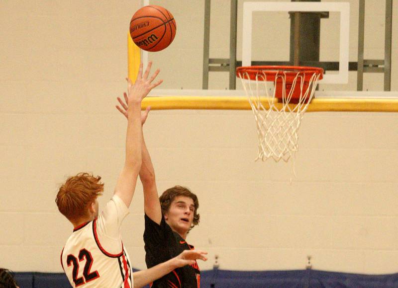 Crystal Lake Central’s Owen Kaiser, right, guards Huntley’s  Logan Darragh (22) during tournament basketball action at Johnsburg High School Monday evening.
