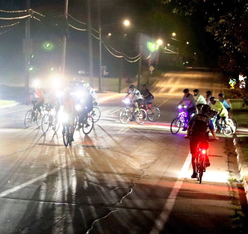 Participants begin the Raue Center for the Arts Night Owl Bike Ride in Crystal Lake on Saturday, August 2, 2025.
