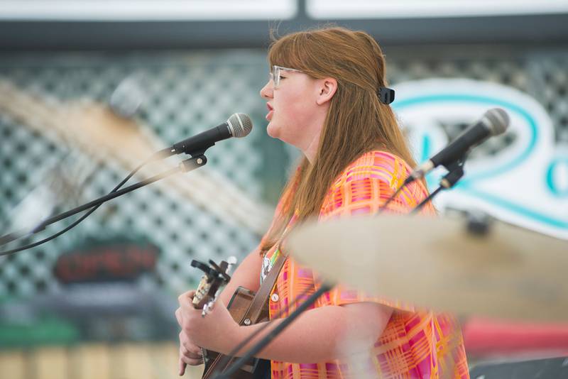 Beth Brill plays an original song for those attending Rosbrook Studio’s street fair Saturday, June 11, 2022 in downtown Dixon. Music, art, food vendors and a skateboarding park brought in a few hundred people for the fundraiser of the music and art venue.