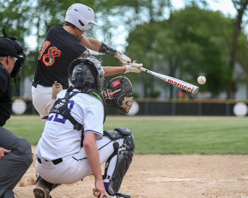 Sandwich's Braden Behringer (18) connects on a pitch during baseball game between Sandwich at Plano.  May 8, 2024