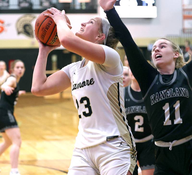 Sycamore's Evyn Carrier gets to the basket ahead of Kaneland's Berlyn Ruh during the Class 3A regional final game Friday, Feb. 17, 2023, at Sycamore High School.