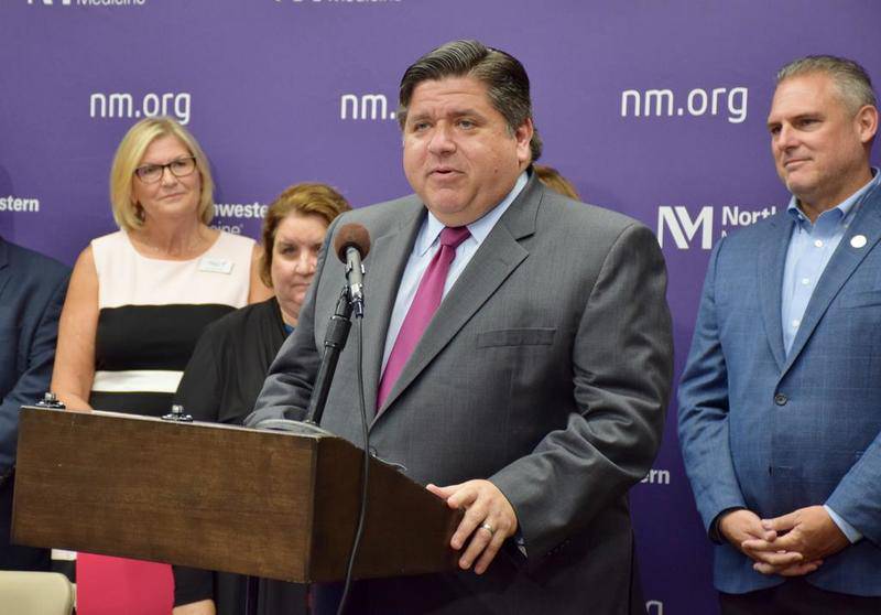 Illinois Gov. JB Pritzker speaks to the crowd at Northwestern Medicine Kishwaukee Hospital in DeKalb on Monday, Aug. 26, before signing into law SB162, a bill that requires health insurance to cover diagnostic mammograms if screening mammography shows they are needed.