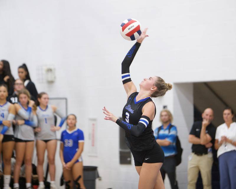 St. Charles North's Amber Czerniak volleys the ball back against Benet on Monday, Oct. 6, 2025 in St. Charles.