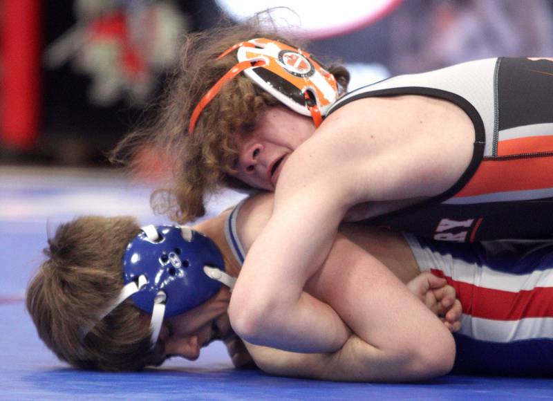 McHenry’s Wyatt Stewart, top, battles Dundee-Crown’s Caleb Yancoskie at 126 pounds in varsity wrestling at Carpentersville Thursday night.