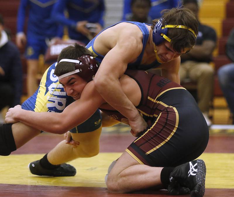 Richmond-Burton's Emment Nelson tries to to control Johnsburg's Erik Bate during the 144-pound match of a Kishwaukee River Conference wrestling match on Thursday, Jan. 25, 2024, at Richmond-Burton High School.