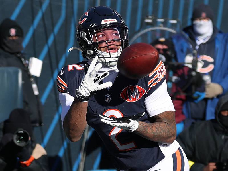 Chicago Bears wide receiver DJ Moore catches a touchdown pass in front of Cleveland Browns cornerback Myles Harden during their game Sunday, Dec. 14, 2025, at Soldier Field in Chicago.