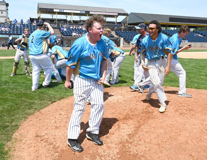 MArquette's Aidan Kath (21) hollars after his team defeated Newman in the supersectional game 12-1 Monday.