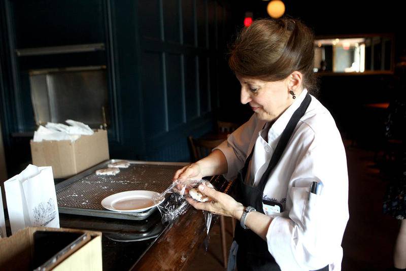 Pastry Chef Laurie Byrge packages walrus cookies at The Walrus Room, located at 415 W. State St. Suite 5 in Geneva.
