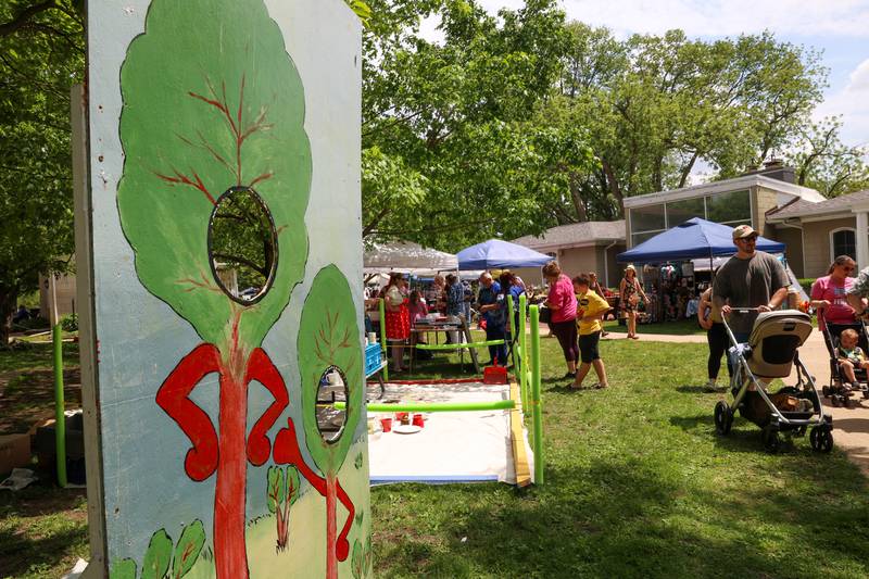 Attendees stroll through the grounds near the kids' zone during the 36th annual Rhubarb Festival at the Kankakee County Museum on Sunday, May 17, 2026.