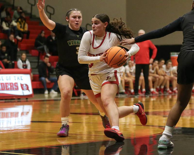 Benet's Aria Mazza (3) drives down the lane during their Class 4A Bolingbrook Sectional final basketball game between Waubonsie Valley at Benet. Feb 27, 2025 in Bolingbrook.