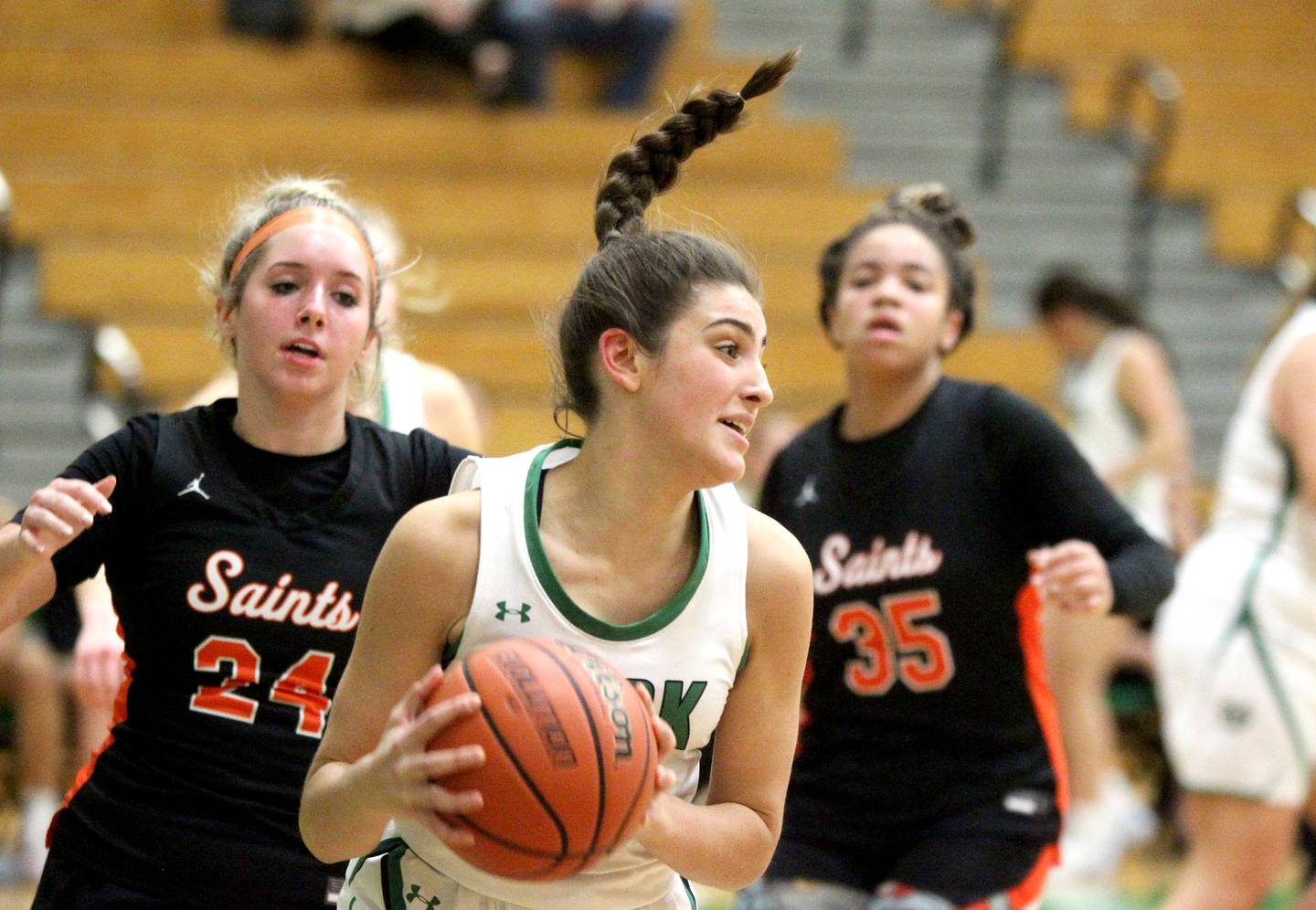 York’s Mia Barton grabs a rebound during a game against St. Charles East in the 11th Annual Thanksgiving Tournament at York Community High School in Elmhurst on Monday, Nov. 14, 2022.